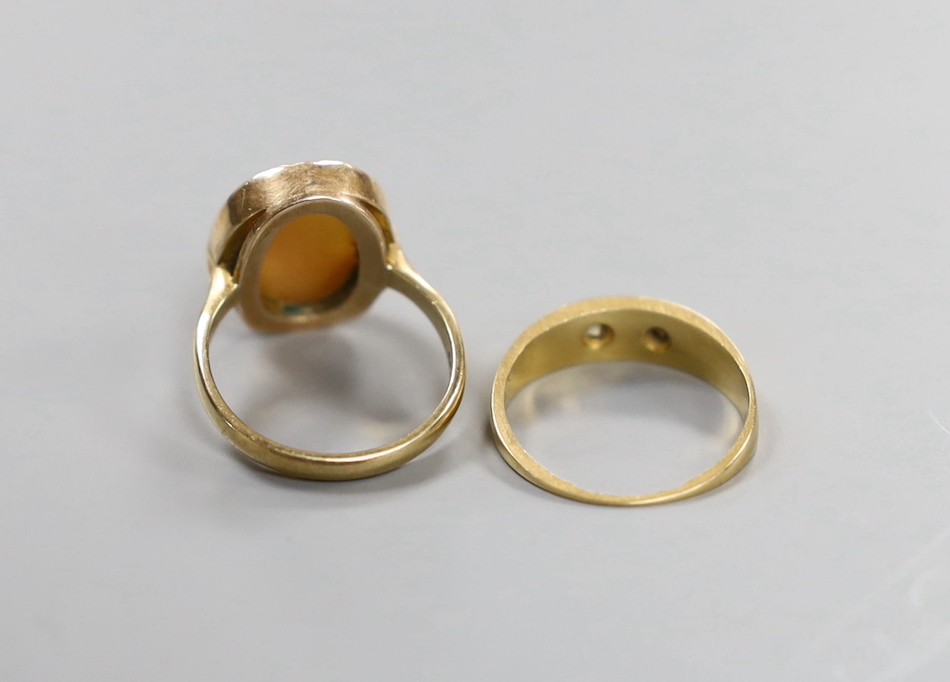 An 18ct and two stone gypsy set diamond ring, gross 2.6 grams and a 9ct gold cameo portrait ring, gross 3.3 grams.